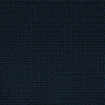 Blue woven fabric texture with irregular pattern, heathered tone, and light-colored thread accents; dense, nubby surface quality.